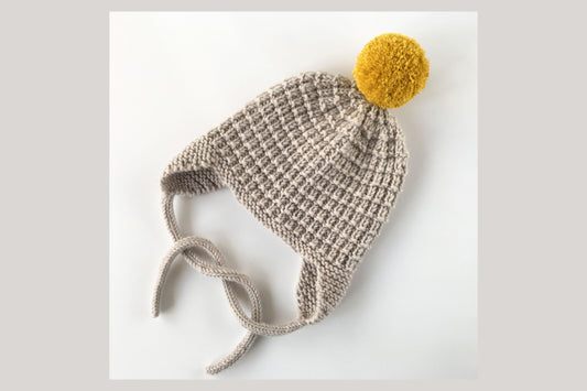 image shows a hat knit using a cable cast on