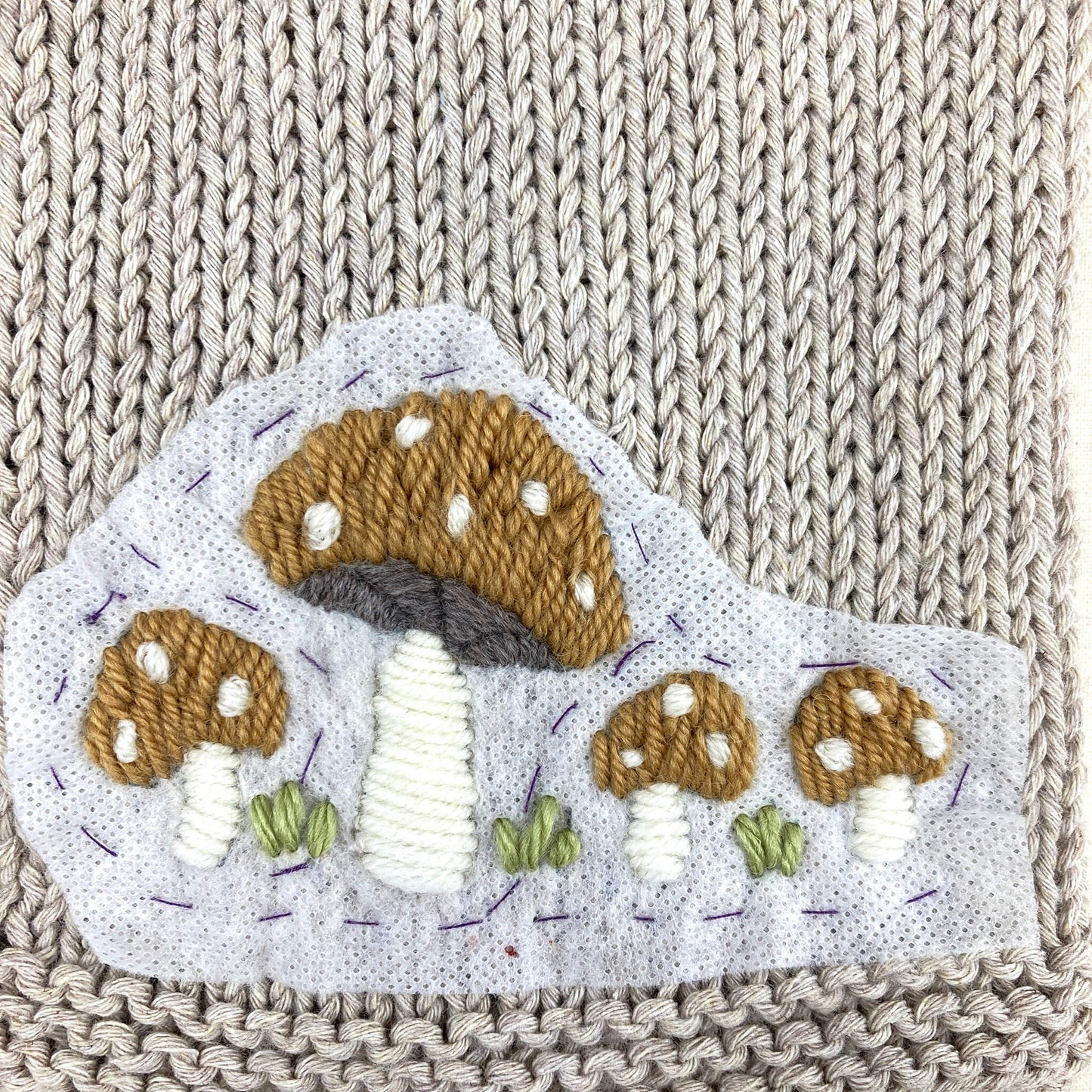 toadstool embroidery for a baby cardigan knitting pattern