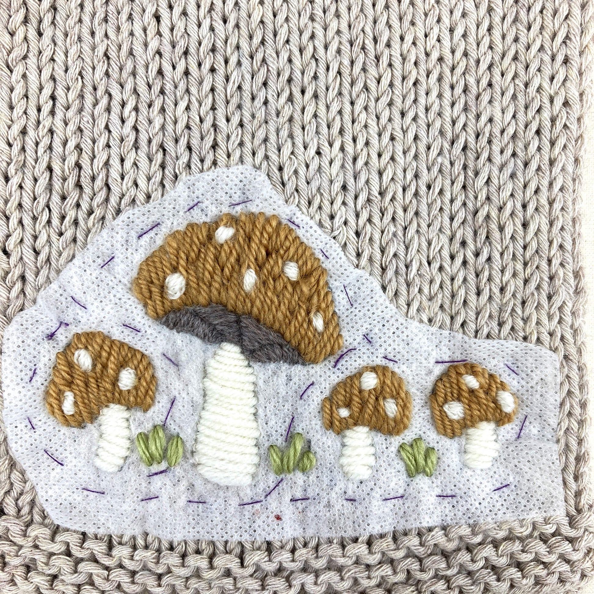 toadstool embroidery for a baby cardigan knitting pattern