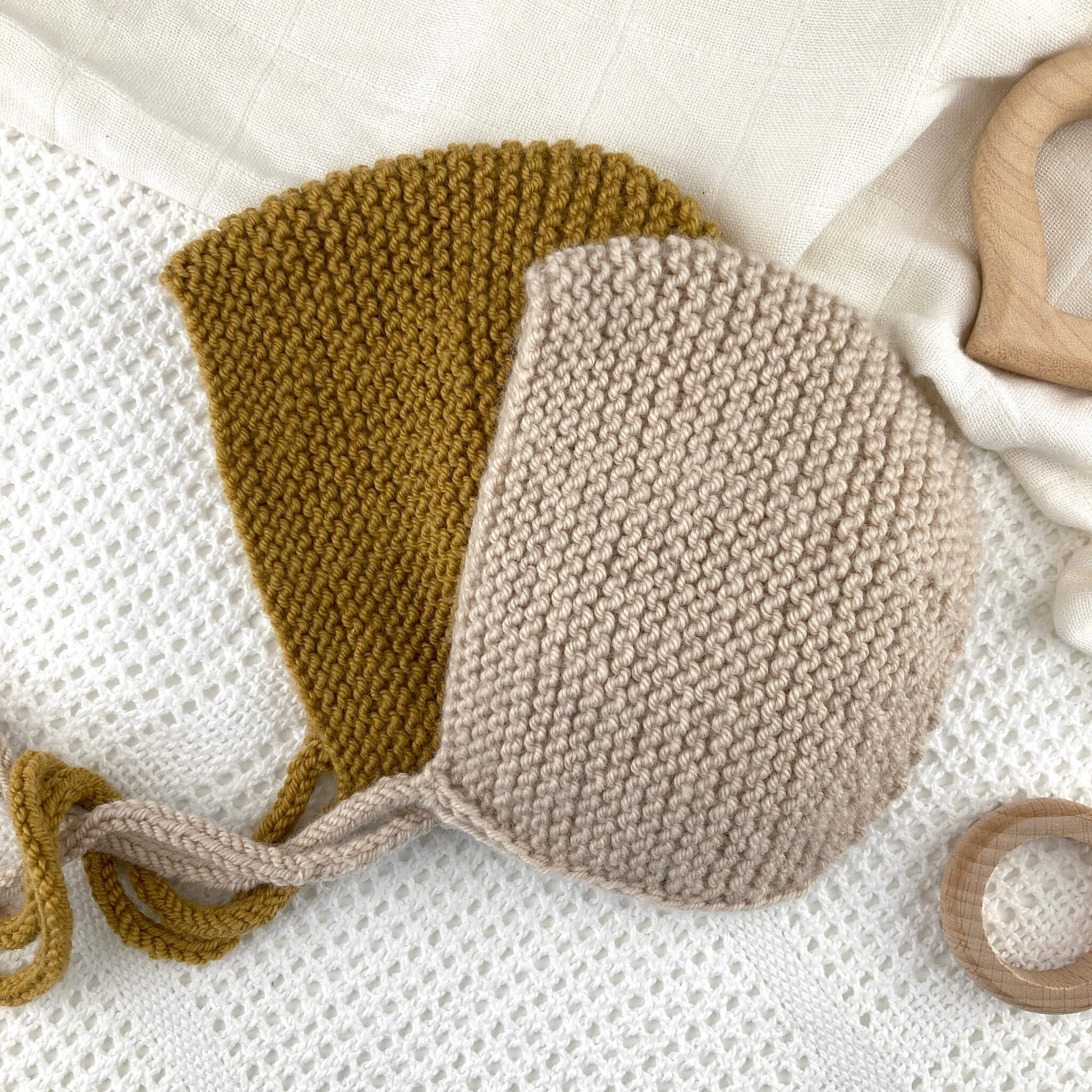 Two baby bonnets for a garter stitch baby bonnet