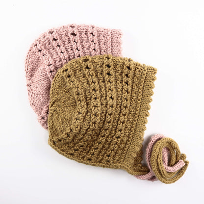 a baby bonnet knitting pattern shown in pink and mustard