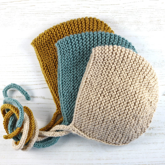 Three garter stitch bonnets for a baby bonnet knitting pattern