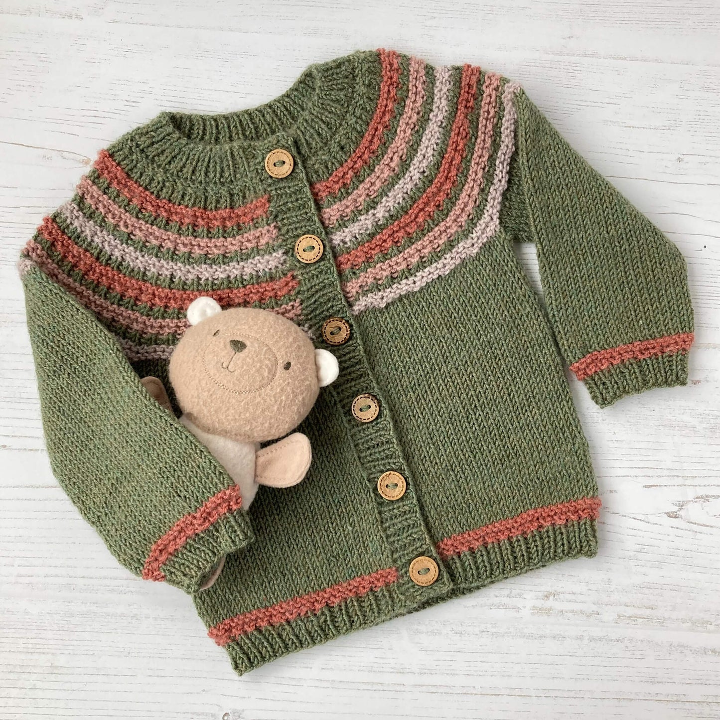 flatlay baby cardigan knit pattern in green