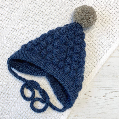 a baby pixie bonnet pattern in dark blue