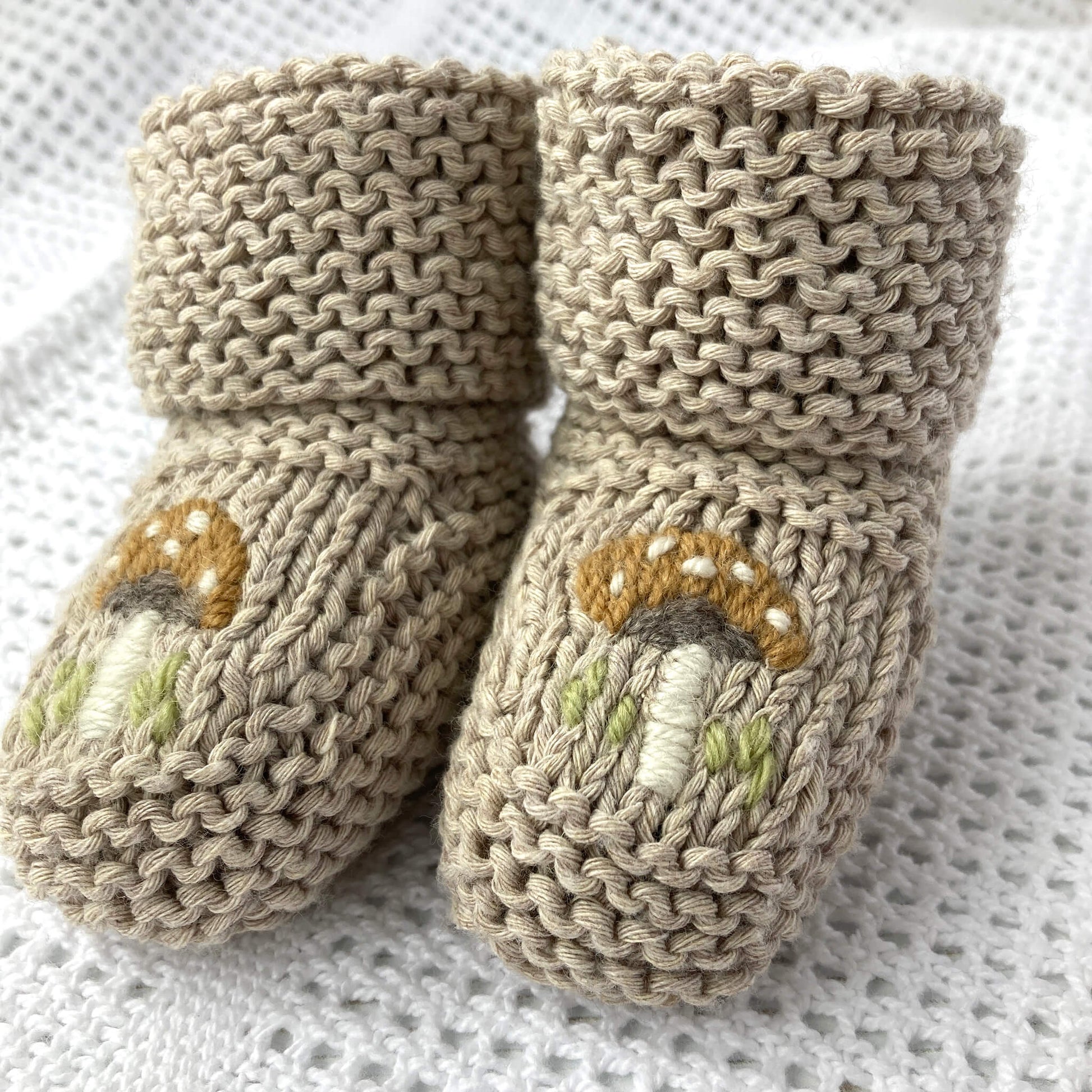 a baby booties knitting pattern with embroidery