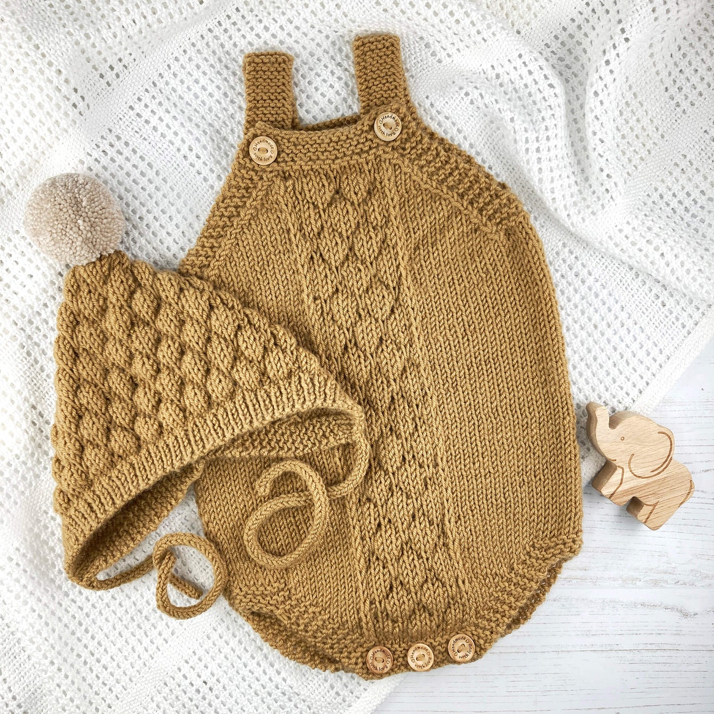 knitting patterns for a bubble stitch romper and pixie hat