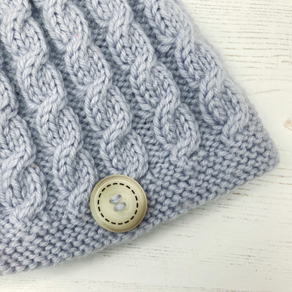 a close up view of the cables on a baby hat knitting pattern