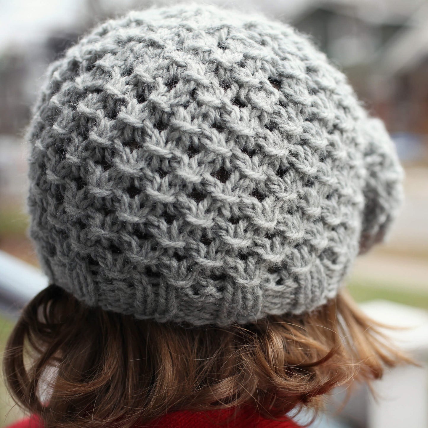 rear view of a chunky lace knit hat pattern