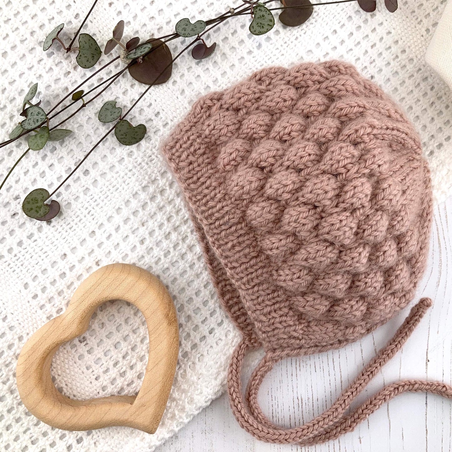 Knitting pattern for baby bonnet with bubble stitch texture