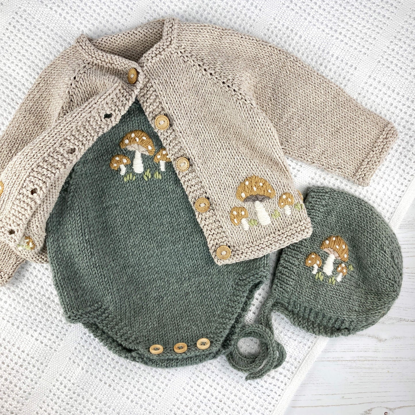 three knitting patterns for baby with included toadstool embroidery