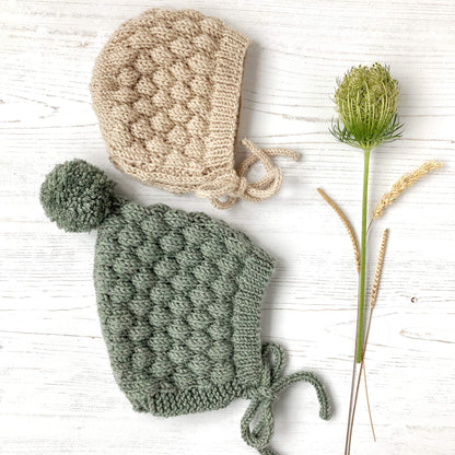 knitting patterns for two styles of baby hat with bubble stitch pattern