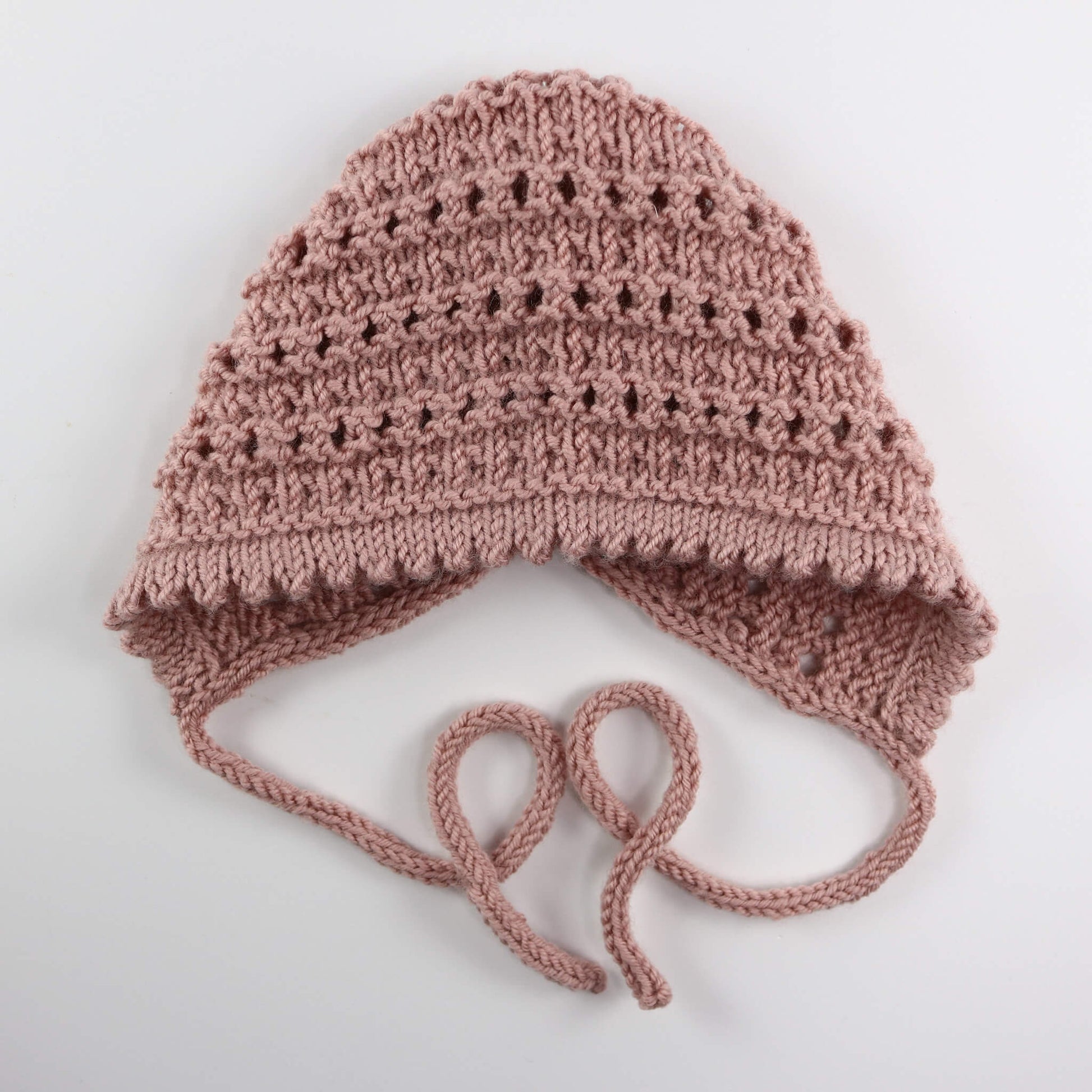 a lace knitting pattern for a bonnet