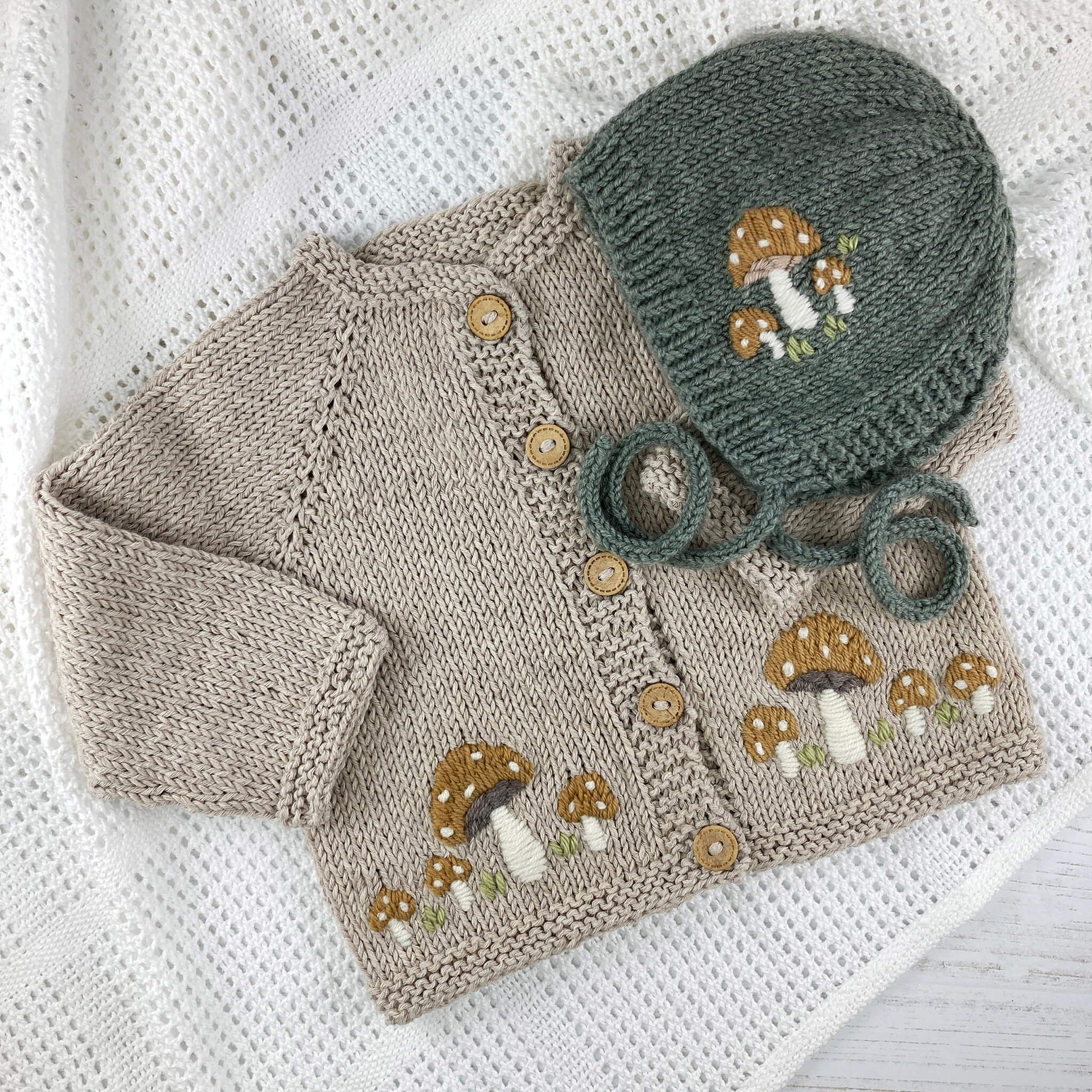 knitting pattern for a toadstool embroidered baby bonnet and cardigan